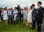 28 July 2016; Ruby Walsh, trainer Willie Mullins, second from right, and the winning connections of Clondaw Warrior after winning the Guinness Galway Hurdle Handicap at the Galway Races in Ballybrit, Co Galway. Photo by Cody Glenn/Sportsfile