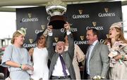 28 July 2016; David Casey lift the trophy between members of the Act D Wagg Syndicate, from left, Gillian Walsh, Aine Casey, Aisling Gannon, Michael &quot;Chips&quot; Gannon and Tamso Doyle after their horse Clondaw Warrior won the Guinness Galway Hurdle Handicap at the Galway Races in Ballybrit, Co Galway. Photo by Cody Glenn/Sportsfile