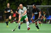 14 June 2016; Team Ireland Eugene Magee  in action against Jagdish Gill of Canada during the Men's Hockey International match between Ireland and Canada at the Trinity Sports Grounds in Dublin. Photo by Ramsey Cardy/Sportsfile