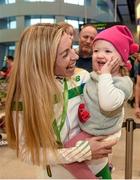 14 December 2015; Team Ireland athlete Lizzie Lee, who won a team bronze medal in the Senior Women's event, is welcomed home by her 18 month old daughter Lucy Kelleher in Dublin Airport on their return home from the SPAR European Cross Country Championship in France. Terminal 2, Dublin Airport, Dublin. Photo by: Paul Mohan / Sportsfile