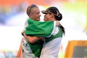 14 August 2013; Team Ireland athlete Robert Heffernan celebrates with his wife Marian after winning the men's 50k walk in a time of 3:37.56. IAAF World Athletics Championships - Day 5. Luzhniki Stadium, Moscow, Russia. Photo by: Stephen McCarthy / Sportsfile