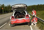 29 July 2016; Craig Breen of Ireland and Scott Martin of Britain checking their Citroen D3S during of the Neste WRC Rally Finland in Hoytia, Finland. Photo by Philip Fitzpatrick/Sportsfile
