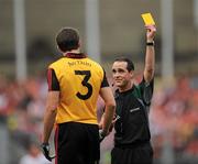 19 September 2010; Referee David Coldrick issues Down's Dan Gordan with a yellow card. GAA Football All-Ireland Senior Championship Final, Down v Cork, Croke Park, Dublin. Picture credit: Brian Lawless / SPORTSFILE