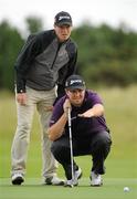 23 September 2010; Shane Lowry and his caddie Andrew Hogan line up a putt on the 3rd green. Ladbrokes.com Irish PGA Championship, Seapoint Golf Club, Co. Louth. Picture credit: Oliver McVeigh / SPORTSFILE