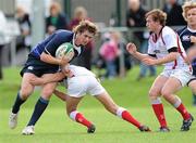 25 September 2010; Joe O'Brien, Leinster, is tackled by Ritchie McMaster, Ulster. U19 Schools Interprovincial (Whites), Leinster v Ulster, Donnybrook Stadium, Dublin. Picture credit: Matt Browne / SPORTSFILE