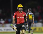 29 July 2016;  Umar Akmal of Trinbago Knight Riders walks off the field after being dismissed for 5 runs during Match 26 of the Hero Caribbean Premier League match between St Kitts and Nevis Patriots and Trinbago Knight Riders at Central Broward Stadium in Lauderhill, Florida, United States of America. Photo by Randy Brooks/Sportsfile