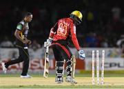 29 July 2016;  Denesh Ramdin (R) of Trinbago Knight Riders bowled by Samuel Badree of St Kitts and Nevis Patriots (L) during Match 26 of the Hero Caribbean Premier League match between St Kitts and Nevis Patriots and Trinbago Knight Riders at Central Broward Stadium in Lauderhill, Florida, United States of America. Photo by Randy Brooks/Sportsfile