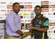 29 July 2016;  Evin Lewis (R) of St Kitts receives the player of the match prize from Dave Cameron (L) president of West Indies Cricket Board at the end of Match 26 of the Hero Caribbean Premier League match between St Kitts and Nevis Patriots and Trinbago Knight Riders at Central Broward Stadium in Lauderhill, Florida, United States of America. Photo by Randy Brooks/Sportsfile