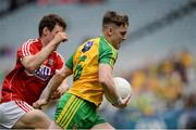 30 July 2016; JD Boyle of Donegal in action against Cathal Maguire of Cork during the Electric Ireland GAA Football All-Ireland Minor Championship Quarter-Final match between Donegal and Cork at Croke Park in Dublin. Photo by Oliver McVeigh/Sportsfile