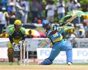 30 July 2016;  Johnson Charles (R) of St Lucia Zouks during Match 27 of the Hero Caribbean Premier League match between St Lucia Zouks and Jamaica Tallawahs at Central Broward Stadium in Lauderhill, Florida, United States of America.  The keeper is Kumar Sangakkara (L) of Jamaica Tallawahs.   Photo by Randy Brooks/Sportsfile