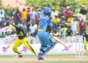 30 July 2016; Rovman Powell (L) of Jamaica Tallawah attempts to run out Johnson Charles (R) of St Lucia Zouks during Match 27 of the Hero Caribbean Premier League match between St Lucia Zouks and Jamaica Tallawahs at Central Broward Stadium in Lauderhill, Florida, United States of America. Photo by Randy Brooks/Sportsfile