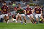 30 July 2016; Evan Regan of Mayo in action against Jamie Gonoud right, Paul Sharry left, of Westmeath during the GAA Football All-Ireland Senior Championship Round 4B match between Westmeath and Mayo at Croke Park in Dublin. Photo by Ray McManus/Sportsfile