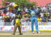 30 July 2016; Daren Sammy (R) of St Lucia Zouks disappointed for not taking a return catch off Chadwick Walton (L) of Jamaica Tallawah during Match 27 of the Hero Caribbean Premier League match between St Lucia Zouks and Jamaica Tallawahs at Central Broward Stadium in Lauderhill, Florida, United States of America. Photo by Randy Brooks/Sportsfile