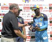30 July 2016;  Andre Fletcher (R) of St Lucia Zouks receives the player of the match prize from Dan West (L), Director of Broward County Parks at the end Match 27 of the Hero Caribbean Premier League match between St Lucia Zouks and Jamaica Tallawahs at Central Broward Stadium in Lauderhill, Florida, United States of America. Photo by Randy Brooks/Sportsfile