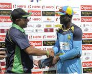 30 July 2016; Andre Fletcher (R) of St Lucia Zouks receives the player of the match prize from Navin Nagrani (L), Executive Vice President Hilco Global at the end of Match 27 of the Hero Caribbean Premier League match between St Lucia Zouks and Jamaica Tallawahs at Central Broward Stadium in Lauderhill, Florida, United States of America. Photo by Randy Brooks/Sportsfile