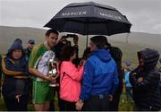 30 July 2016; James McInerney of Clare shelters from the rain with the Corn Setanta after winning the M Donnelly All-Ireland Poc Fada in the Annaverna Mountain, Ravensdale, Co Louth. Photo by Piaras Ó Mídheach/Sportsfile