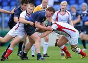 25 September 2010; Tadhg Furlong, Leinster, is tackled by Alistair Andress and Jonny Murphy, Ulster. U19 Schools Interprovincial (Blues), Leinster v Ulster, Donnybrook Stadium, Dublin. Picture credit: Matt Browne / SPORTSFILE