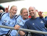 26 September 2010; Dublin players Sorcha Furlong, left, and Amy McGuinness celebrate with Selector Tommy Brown after the game. TG4 All-Ireland Senior Ladies Football Championship Final, Dublin v Tyrone, Croke Park, Dublin. Picture credit: Dáire Brennan / SPORTSFILE