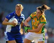 26 September 2010; Gráinne Enright, Waterford, in action against Gráinne Houston, Donegal. TG4 All-Ireland Intermediate Ladies Football Championship Final, Donegal v Waterford, Croke Park, Dublin. Picture credit: Dáire Brennan / SPORTSFILE