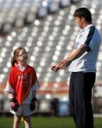 27 September 2010; 300 children from all over the country realised their dreams today when they got to play a match in the world-famous Croke Park stadium as part of the 2010 Vhi Cúl Day Out. The Vhi Cúl Day Out is a nationwide competition which was open to all 80,000 children who attended one of the 1000 Vhi GAA Cúl Camps held over the course of the summer. Today’s lucky 300 winners got to train and play a match in the world-famous stadium. GAA heroes such as Bernard Brogan, Anthony Daly and Eoin Kelly as well as other hurling, football, camogie and handball stars around the country were there to work with the children on the day to help them develop their skills and reinforce their passion for the game. Pictured is Seana Feeley, age 10, from Belcoo, Co. Fermanagh, in conversation with Dublin footballer Éamon Fennell. Vhi GAA Cúl Day Out 2010, Croke Park, Dublin. Picture credit: Brendan Moran / SPORTSFILE