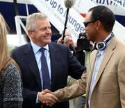 27 September 2010; Team Europe 2010 captain Colin Montgomerie welcomes Tigers Woods as the USA team arrives at Cardiff Airport ahead of the 39th annual Ryder Cup. Cardiff Airport, Wales. Picture credit: Ryder Cup Europe / SPORTSFILE