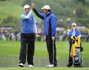 29 September 2010; Padraig Harrington congratulates his playing partner Ross Fisher after his birdie on the 6th green. 2010 Ryder Cup - Practice Day, The Celtic Manor Resort, City of Newport, Wales. Picture credit: Matt Browne / SPORTSFILE