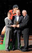 29 September 2010; Three players from this year's two All-Ireland title winners and a fourth from beaten football finalists Down collected the last of the 2010 GAA Player of the Month Awards, sponsored by Vodafone. Uachtarán Chumann Lúthchleas Gael Criostóir Ó Cuana presents Tom and Eileen Clarke with the August footballer award, accepting on behalf of their son Down footballer Martin. Westbury Hotel, Dublin. Picture credit: Stephen McCarthy / SPORTSFILE
