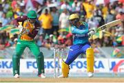 30 July 2016; (R) Shoaib Malik of the Barbados Tridents cuts the ball for four and Anthony Bramble of Guyana Amazon Warriors (L) looks on during the Hero Caribbean Premier League (CPL) Match 28 between Barbados Tridents and  Guyana Amazon Warriors at Central Broward Stadium in Fort Lauderdale, Florida, USA. Photo by Ashley Allen/Sportsfile