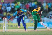 30 July 2016; (R) Ravi Rampaul of Barbados Tridents attempts to run out Chrs Barnwell (L) of Guyana Amazon Warriors during the Hero Caribbean Premier League (CPL) Match 28 between Barbados Tridents and  Guyana Amazon Warriors at Central Broward Stadium in Fort Lauderdale, Florida, USA. Photo by Ashley Allen/Sportsfile