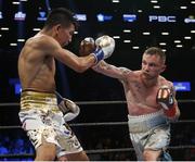 Jul 30 2016; Carl Frampton, right, of Northern Ireland exchanges punches with Leo Santa Cruz of Mexico during their WBA super world featherweight championship boxing match at the Barclays Center, Brooklyn, New York, USA. Photo by Noah K. Murray/Sportsfile