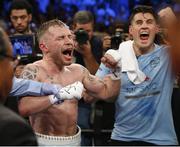 Jul 30 2016; Carl Frampton of Northern Ireland and trainer Shane McGuigan, right, celebrate his victory over Leo Santa Cruz of Mexico after their WBA super world featherweight championship boxing match at the Barclays Center, Brooklyn, New York, USA. Photo by Noah K. Murray/Sportsfile