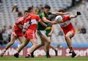 31 July 2016; Ferdia O'Brien of Kerry in action against Derry's, from left, Shea Downey, Aaron Bradley and Eoghan Concannon during the Electric Ireland GAA Football All-Ireland Minor Championship Quarter-Final match between Kerry and Derry at Croke Park in Dublin. Photo by Piaras Ó Mídheach/Sportsfile