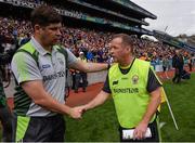 31 July 2016; Kerry manager Eamonn Fitzmaurice, left, shakes hands with Clare manager Colm Collins after the GAA Football All-Ireland Senior Championship Quarter-Final match between Clare and Kerry at Croke Park in Dublin. Photo by Piaras Ó Mídheach/Sportsfile