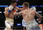Jul 30 2016; Carl Frampton, right, of Northern Ireland exchanges punches with Leo Santa Cruz of Mexico during their WBA super world featherweight championship boxing match at the Barclays Center, Brooklyn, New York, USA. Photo by Noah K. Murray/Sportsfile
