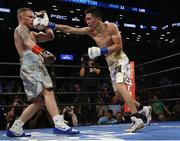 Jul 30 2016; Carl Frampton, left, of Northern Ireland exchanges punches with Leo Santa Cruz of Mexico during their WBA super world featherweight championship boxing match at the Barclays Center, Brooklyn, New York, USA. Photo by Noah K. Murray/Sportsfile