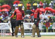31 July 2016; William Perkins (L) and Denesh Ramdin (R) of Trinbago Knight Riders 50 run partnership during Match 29 of the Hero Caribbean Premier League match between Trinbago Knight Riders and St Kitts and Nevis Patriots at Central Broward Stadium in Lauderhill, Florida, United States of America. Photo by Randy Brooks/Sportsfile