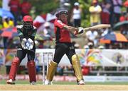 31 July 2016; Brendon McCullum (R) of Trinbago Knight Riders hits 4, watched by Devon Thomas (L) of St. Kitts & Nevis Patriots during Match 29 of the Hero Caribbean Premier League match between Trinbago Knight Riders and St Kitts and Nevis Patriots at Central Broward Stadium in Lauderhill, Florida, United States of America. Photo by Randy Brooks/Sportsfile