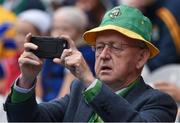 31 July 2016; A Kerry supporter takes a picture on his 'smart phone' prior to the GAA Football All-Ireland Senior Championship Quarter-Final match between Kerry and Clare at Croke Park in Dublin. Photo by Ray McManus/Sportsfile