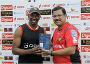 31 July 2016; Dwayne Bravo (L) of Trinbago Knight Riders receives the player of the match prize from Venky Mysore (R) managing director of Trinbago Knight Riders at the end of Match 29 of the Hero Caribbean Premier League match between Trinbago Knight Riders and St Kitts and Nevis Patriots at Central Broward Stadium in Lauderhill, Florida, United States of America. Photo by Randy Brooks/Sportsfile.