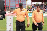 31 July 2016; Umpires Patrick Gustard (L) and Johan Cloete(R) walk out to the field of play during Match 30 of the Hero Caribbean Premier League match between Jamaica Tallawahs v St Lucia Zouks at Central Broward Stadium in Lauderhill, Florida, United States of America. Photo Ashley Allen/Sportsfile