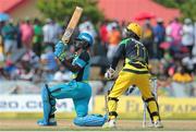 31 July 2016; Zouks batsman Andre Fletcher (L) hits a six over midwicket as Kumar Sangakkara (R) looks on during Match 30 of the Hero Caribbean Premier League match between Jamaica Tallawahs v St Lucia Zouks at Central Broward Stadium in Lauderhill, Florida, United States of America. Photo Ashley Allen/Sportsfile