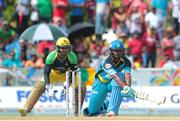 31 July 2016; Zouks batsman Johnson Charles plays a reverse sweep as Kumar Sangakarra looks on during Match 30 of the Hero Caribbean Premier League match between Jamaica Tallawahs v St Lucia Zouks at Central Broward Stadium in Lauderhill, Florida, United States of America. Photo Ashley Allen/Sportsfile