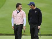 30 September 2010; Graeme McDowell and Padraig Harrington, Team Europe, on the 18th green. 2010 Ryder Cup - Practice Day, The Celtic Manor Resort, City of Newport, Wales. Picture credit: Matt Browne / SPORTSFILE