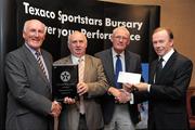 30 September 2010; Presenting Derry Doody and Ned Harrington of Passage West GAA Club, Passage West, Co. Cork, with their award at the 2010 Texaco Sportstars Bursaries Awards Presentation are Eddie Keher, left, and Enda Riney, right, Country Chairman of Chevron Ireland. Conrad Hotel, Earlsfort Terrace, Dublin. Picture credit: Barry Cregg / SPORTSFILE