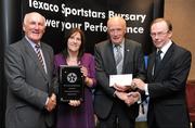 30 September 2010; Presenting Edel Hanley and Eamon Whelan of Tommie Larkins GAA Club, Loughrea, Co. Galway, with their award at the 2010 Texaco Sportstars Bursaries Awards Presentation are Eddie Keher, left, and Enda Riney, right, Country Chairman of Chevron Ireland. Conrad Hotel, Earlsfort Terrace, Dublin. Picture credit: Barry Cregg / SPORTSFILE