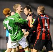 1 October 2010; Mark Quigley, Bohemians, is restrained by team-mate Glen Cronin, 4, and Derek Prendergast after an altercation with Adam Mitchell, Bray Wanderers, 4, for which he received a red card from referee Pauric Sutton. Airtricity League Premier Division, Bohemians v Bray Wanderers, Dalymount Park, Dublin. Picture credit: Stephen McCarthy / SPORTSFILE