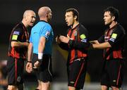 1 October 2010; Mark Quigley, Bohemians, centre, protests with referee Pauric Sutton, after receiving a red card, with team-mates Paul Keegan, left, and Mark Rossiter, right. Airtricity League Premier Division, Bohemians v Bray Wanderers, Dalymount Park, Dublin. Picture credit: Stephen McCarthy / SPORTSFILE