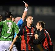 1 October 2010; Mark Quigley, Bohemians, right, receives a red card from referee Pauric Sutton. Airtricity League Premier Division, Bohemians v Bray Wanderers, Dalymount Park, Dublin. Picture credit: Stephen McCarthy / SPORTSFILE
