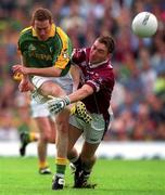 5 August 2001; Donal Curtis of Meath has a shot on goal despite the attentions of David Mitchell of Westmeath during the Bank of Ireland All-Ireland Senior Football Championship Quarter-Final match between Meath and Westmeath at Croke Park in Dublin. Photo by Ray McManus/Sportsfile