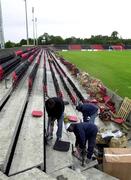 8 August 2001; Construction workers finishes the installation of seating at Flancare Park in Longford ahead of the UEFA Cup Preliminary Round First Leg match between Longford Town and FC Liteks Lovech tomorrow. Photo by David Maher/Sportsfile